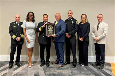 Members of the Fire Department and City Receiving Accreditation Plaque